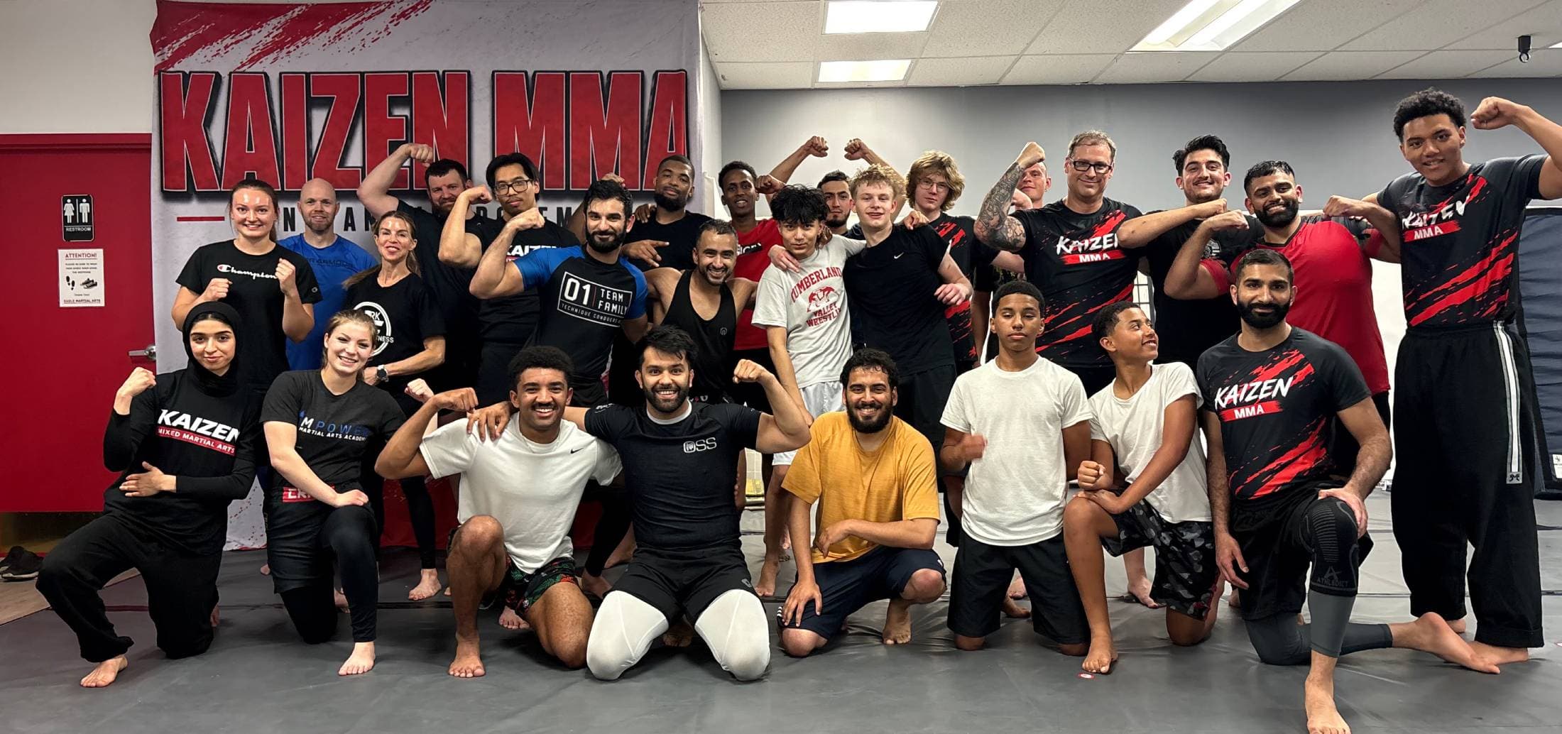 Kaizen MMA group photographed at the school